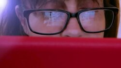 Woman using digital tablet, glasses reflections. Stock Footage