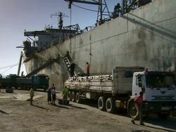 MS Workers merchandising boat unloading / Djibouti Stock Footage
