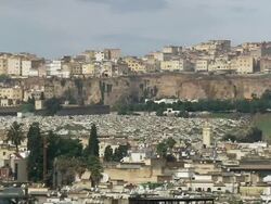 WS View of wall old town and buildings on cliffs above Medina / Fez, Fes-Boulemane, Morocco Stock Footage