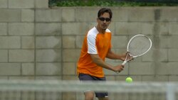 Two men playing outdoor tennis together. - Slow Motion Stock Footage