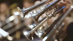 Musician playing French horn during concert Stock Footage