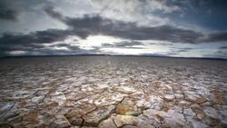Dry, cracked earth and clouds Stock Footage