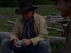 Cowboys sit around a fire Stock Footage