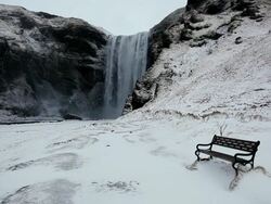 MS Shot of Empty bench next to waterfall / Iceland  Stock Footage