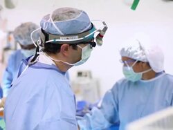 Doctors performing a surgery Stock Footage