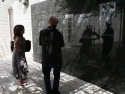 Mid shot of multiple tourists spectating memorial. Stock Footage