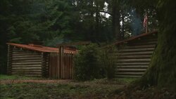 Log cabins stand in the forest at Fort Clatsop National Memorial in Oregon. Stock Footage