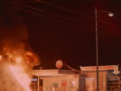 MS View of huge fire at rural gas station / Unspecified Stock Footage