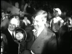 Comedian Will Rogers introduces New York Governor Franklin D. Roosevelt at a festive 1932 presidential campaign event. News Clip