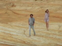 WS TS Couple walking on sand stone / Cape Kiwanda, Oregon, USA Stock Footage