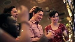 Friends celebrate as guy hits jackpot on slot machine in Vegas casino Stock Footage