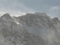 MS Shot of Ominous Jagged Mountain Peak, Snow Covered with powerful clouds sweeping over / Telluride, Colorado, United States Stock Footage