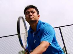 Joe's Tennis Serve - Low Angle Stock Footage