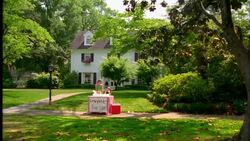 A brother and sister man the lemonade stand in front of their suburban home. Stock Footage