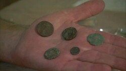 A hand holds several antique coins. Stock Footage