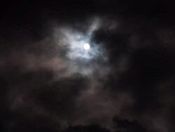 Moon and Clouds Against Black Sky Stock Footage