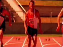 MS tilt up to athletes running to camera on track, dipping for finish, Australia Stock Footage