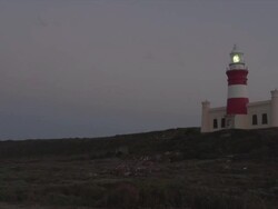 WS View of Lighthouse at night/ Cape Agulhas, Western Cape, South Africa Stock Footage