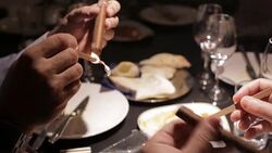 Lighting a cigar with cedar Stock Footage