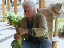 MS Man Shucking corn on his porch / Lamy, New Mexico, United States Stock Footage