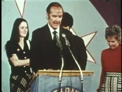 Eleanor McGovern watches as her husband, U.S. Senator George McGovern, give his concession speech during the 1972 presidential elections. News Clip