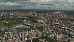 Low storm clouds loom over  a sports stadium in the city of Natal, Brazil. Stock Footage