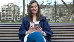 Young girl texting on smart phone Stock Footage