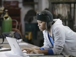 MS Female iron worker using at laptop in factory / Auburn, Washington, USA Stock Footage