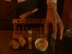 Mercury, sulphur, salamoniac (ammonium chloride) and Arsenic sulphide being displayed in front of test tube holder, UK (sound available) Stock Footage