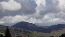 Clouds cast shadows on mountains peaks. Stock Footage