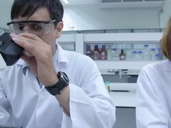 HD : Scientist Couple using microscope Stock Footage