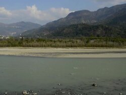 WS PAN Shot of ganges river with mountains in background / Rishikesh, Uttarakhand, India Stock Footage