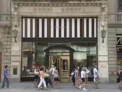 MS, Pedestrians passing by Henri Bendel store, Fifth Avenue, New York City, New York, USA Stock Footage