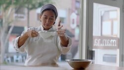 Pastry chef sifts flour on table and rolls dough in flour Stock Footage
