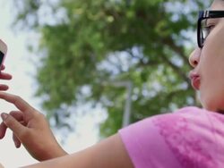 Cute Girl Takes Pictures of Herself Stock Footage