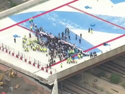 Aerial Views of Bridge Walk Marking Two Years  News Clip