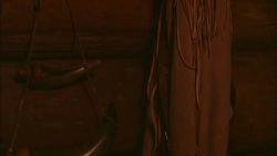 Buckskins and a powder horn hang on a cabin wall. Stock Footage