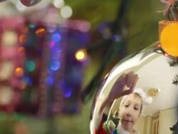 boy decorates a Christmas tree Stock Footage