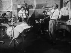 Famous French trumpeter, Georges Jouvin, recording in studio with band. Stock Footage