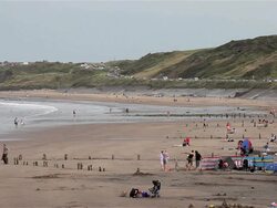 HOLIDAY MAKERS ON BEACH Stock Footage