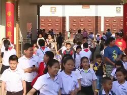 WS ZI SLO MO School childrenwalking out after  school hours / Vientiane, Laos  Stock Footage