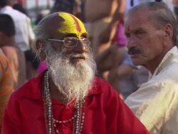CU ZO Elderly sadhu sitting on banks of Ganges at Hari ki Pauri / Haridwar, Uttarakhand, India Stock Footage