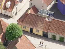 WS AERIAL ZI ZO View of Hans Christian Andersens House / Fyn, Denmark Stock Footage