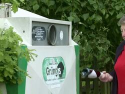 MS woman throwing bottles in bottle bank / Saarburg, Rhineland-Palatinate, Germany Stock Footage