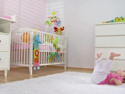 HD CRANE: Baby Girl Having Fun On The Carpet Stock Footage