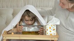 little boy breathes vapors herbal decoction Stock Footage