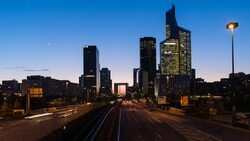 Paris road leading towards La Grand Arche and modern office buildings at La Defense, Paris, France - Time lapse Stock Footage