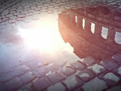 Coliseum reflected in rain water Stock Footage