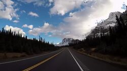 Car driving on Icefields parkway scenic road Stock Footage