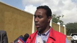 CLEAN : Relatives care for the bodies after car bombs in Somali capital News Clip